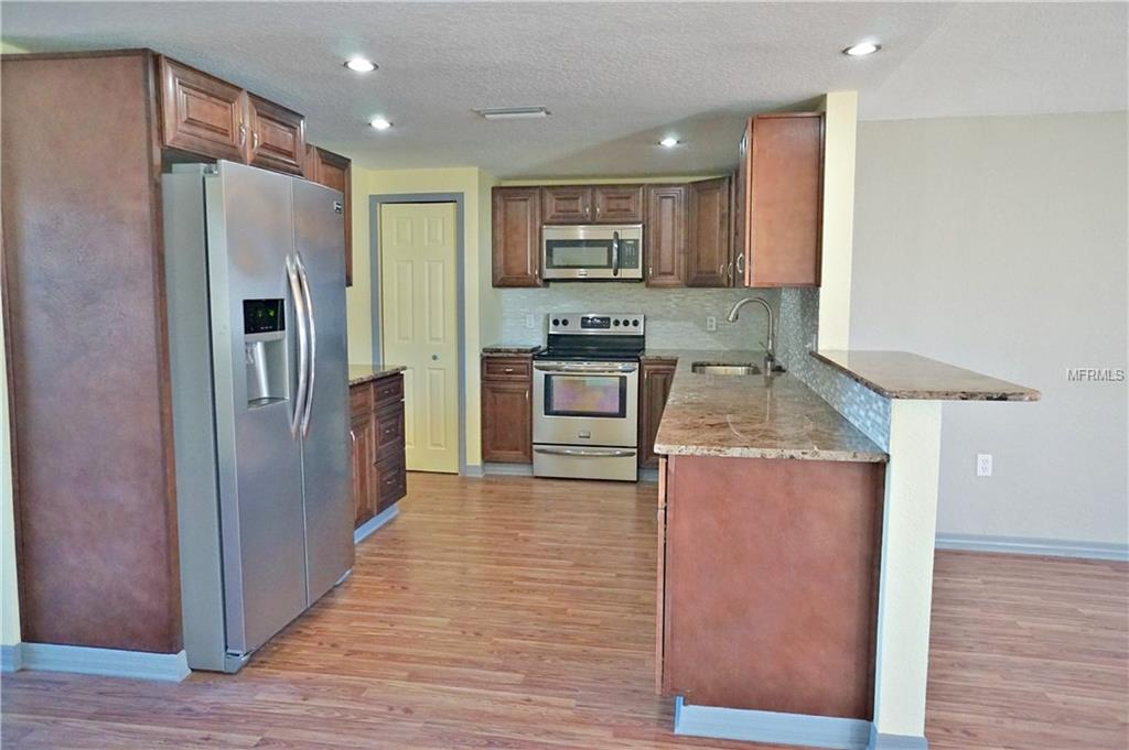 9305 MANSARD LANE, PORT RICHEY, Florida 34668, 3 Bedrooms Bedrooms, 4 Rooms Rooms,2 BathroomsBathrooms,Residential,For sale,MANSARD,U7846758