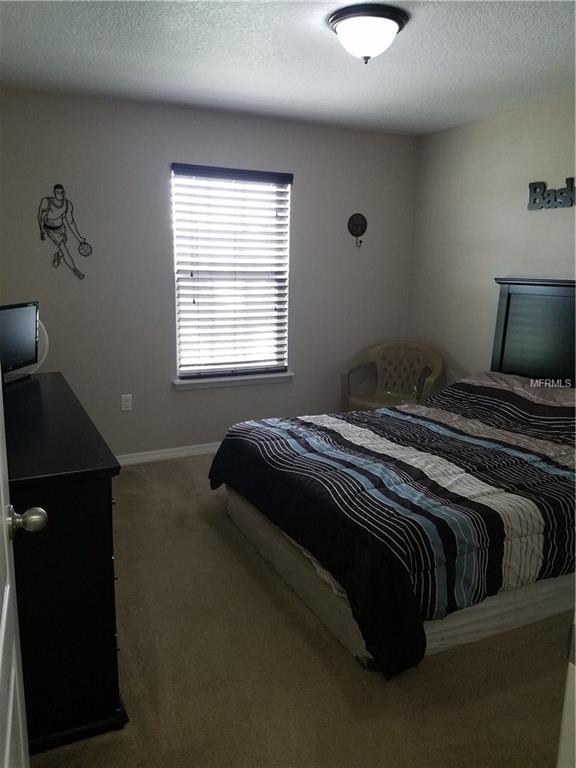 3051 PATTERSON GROVES DRIVE, HAINES CITY, Florida 33844, 4 Bedrooms Bedrooms, 6 Rooms Rooms,2 BathroomsBathrooms,Residential,For sale,PATTERSON GROVES,S4847995