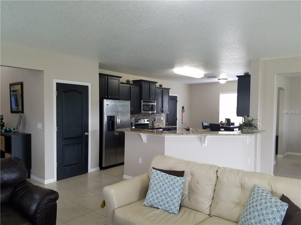 3051 PATTERSON GROVES DRIVE, HAINES CITY, Florida 33844, 4 Bedrooms Bedrooms, 6 Rooms Rooms,2 BathroomsBathrooms,Residential,For sale,PATTERSON GROVES,S4847995