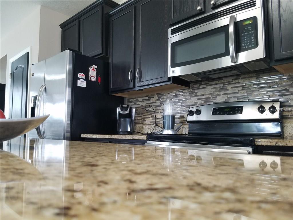 3051 PATTERSON GROVES DRIVE, HAINES CITY, Florida 33844, 4 Bedrooms Bedrooms, 6 Rooms Rooms,2 BathroomsBathrooms,Residential,For sale,PATTERSON GROVES,S4847995