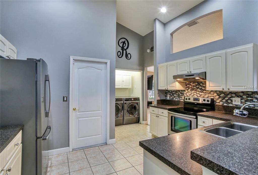 1240 BLUFFS CIRCLE, DUNEDIN, Florida 34698, 3 Bedrooms Bedrooms, 4 Rooms Rooms,2 BathroomsBathrooms,Residential,For sale,BLUFFS,U7847477