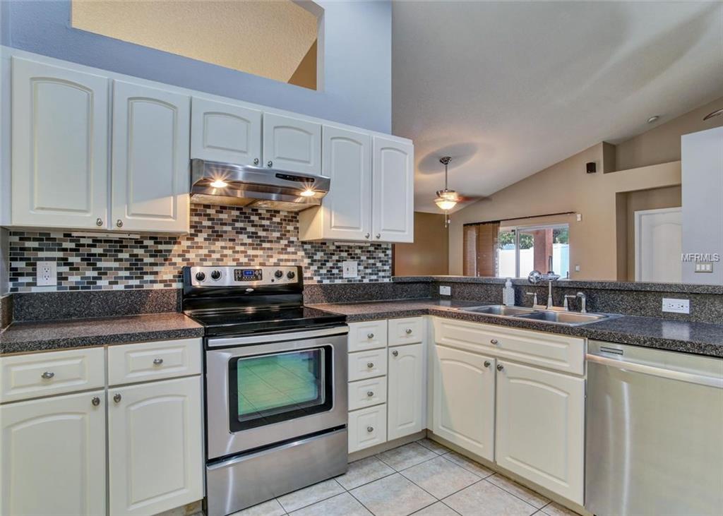 1240 BLUFFS CIRCLE, DUNEDIN, Florida 34698, 3 Bedrooms Bedrooms, 4 Rooms Rooms,2 BathroomsBathrooms,Residential,For sale,BLUFFS,U7847477