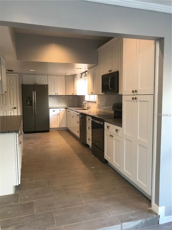 6311 ORANGE COVE DRIVE, ORLANDO, Florida 32819, 3 Bedrooms Bedrooms, 5 Rooms Rooms,3 BathroomsBathrooms,Residential,For sale,ORANGE COVE,O5548811