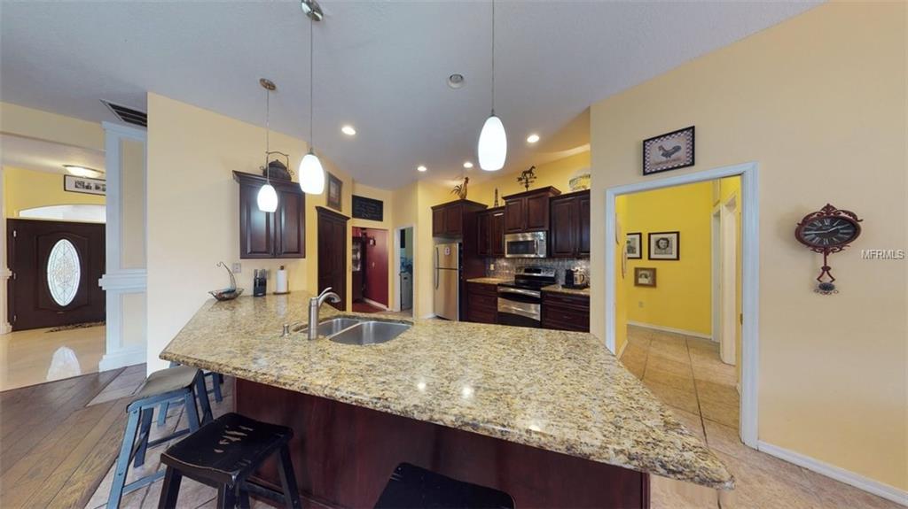 3442 WOODRIDGE PARKWAY, PALM HARBOR, Florida 34684, 4 Bedrooms Bedrooms, 5 Rooms Rooms,3 BathroomsBathrooms,Residential,For sale,WOODRIDGE,U7847044