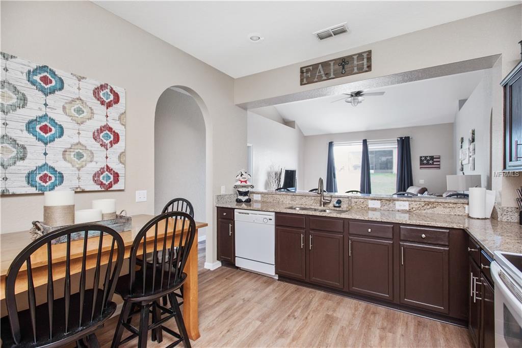 8230 WOODVINE CIRCLE, LAKELAND, Florida 33810, 4 Bedrooms Bedrooms, 8 Rooms Rooms,2 BathroomsBathrooms,Residential,For sale,WOODVINE,T2921352