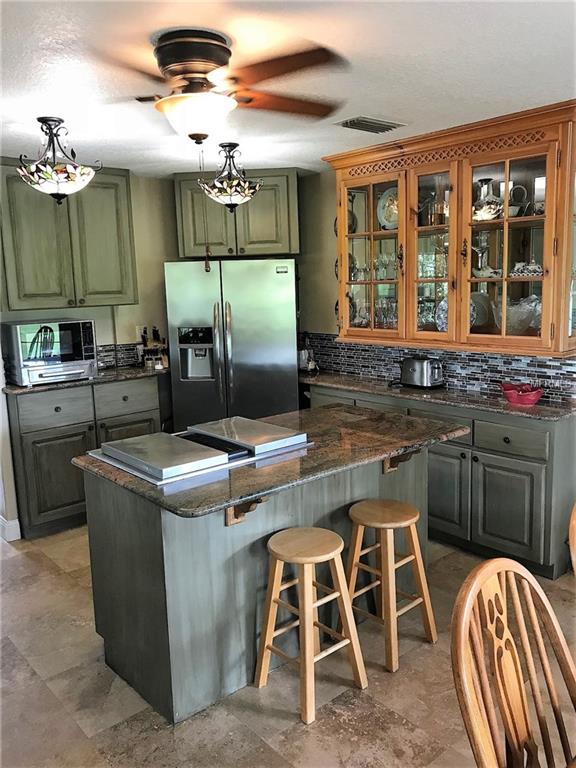 13625 FLORIDA AVENUE, ASTATULA, Florida 34705, 4 Bedrooms Bedrooms, 8 Rooms Rooms,3 BathroomsBathrooms,Residential,For sale,FLORIDA,G4847142