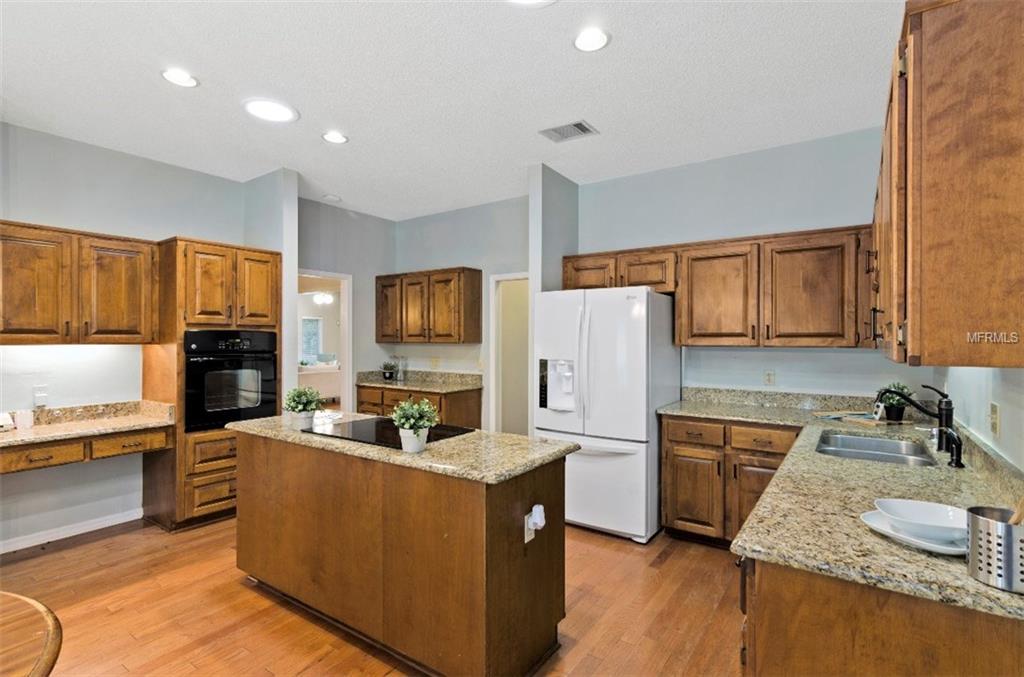 7133 WOODED VILLAGE LANE, ORLANDO, Florida 32835, 5 Bedrooms Bedrooms, 8 Rooms Rooms,3 BathroomsBathrooms,Residential,For sale,WOODED VILLAGE,O5557936