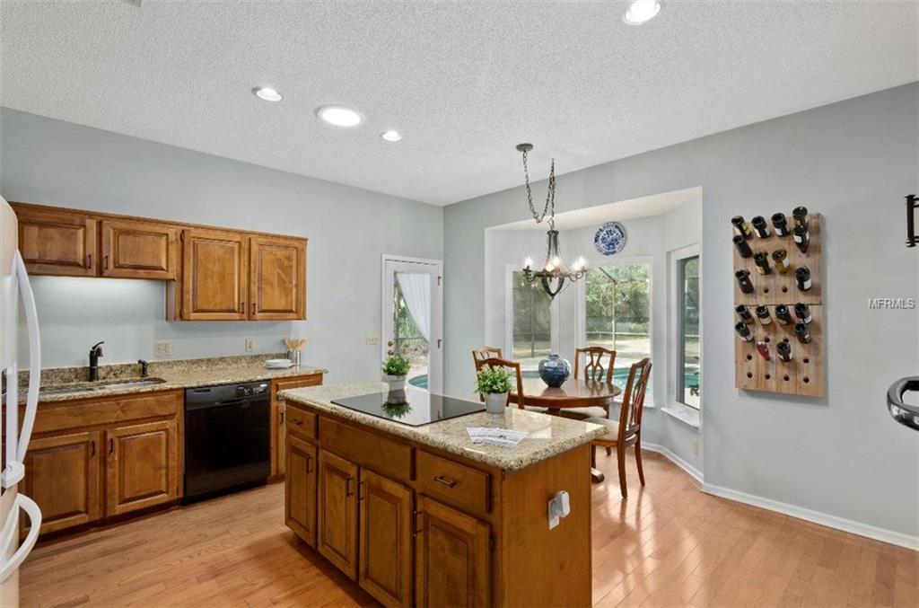 7133 WOODED VILLAGE LANE, ORLANDO, Florida 32835, 5 Bedrooms Bedrooms, 8 Rooms Rooms,3 BathroomsBathrooms,Residential,For sale,WOODED VILLAGE,O5557936