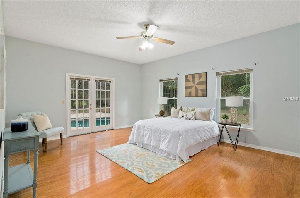 7133 WOODED VILLAGE LANE, ORLANDO, Florida 32835, 5 Bedrooms Bedrooms, 8 Rooms Rooms,3 BathroomsBathrooms,Residential,For sale,WOODED VILLAGE,O5557936