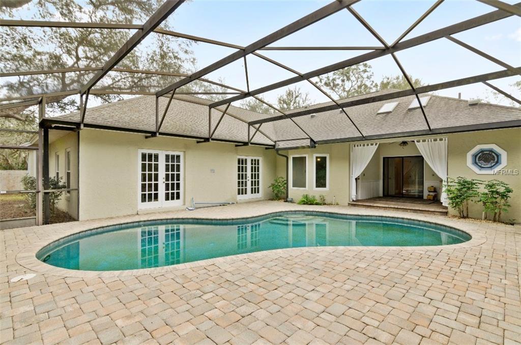 7133 WOODED VILLAGE LANE, ORLANDO, Florida 32835, 5 Bedrooms Bedrooms, 8 Rooms Rooms,3 BathroomsBathrooms,Residential,For sale,WOODED VILLAGE,O5557936