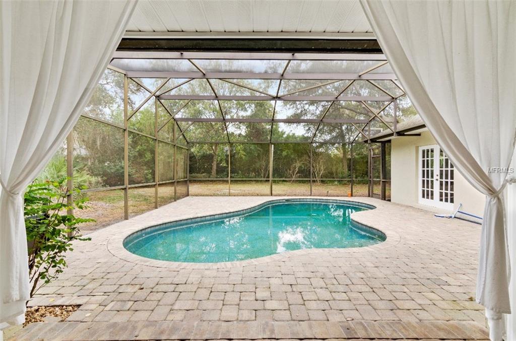 7133 WOODED VILLAGE LANE, ORLANDO, Florida 32835, 5 Bedrooms Bedrooms, 8 Rooms Rooms,3 BathroomsBathrooms,Residential,For sale,WOODED VILLAGE,O5557936