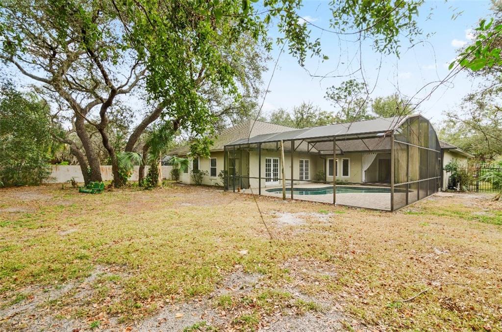 7133 WOODED VILLAGE LANE, ORLANDO, Florida 32835, 5 Bedrooms Bedrooms, 8 Rooms Rooms,3 BathroomsBathrooms,Residential,For sale,WOODED VILLAGE,O5557936