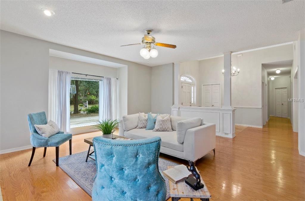 7133 WOODED VILLAGE LANE, ORLANDO, Florida 32835, 5 Bedrooms Bedrooms, 8 Rooms Rooms,3 BathroomsBathrooms,Residential,For sale,WOODED VILLAGE,O5557936