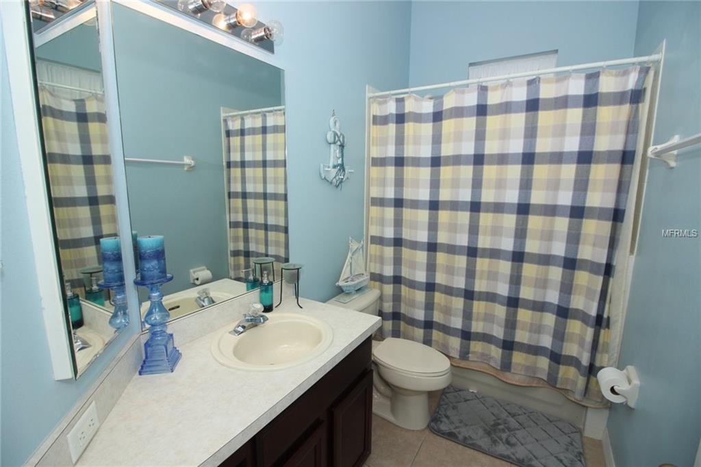 8493 LAKE WINDHAM AVENUE, ORLANDO, Florida 32829, 5 Bedrooms Bedrooms, 10 Rooms Rooms,3 BathroomsBathrooms,Residential,For sale,LAKE WINDHAM,O5556161