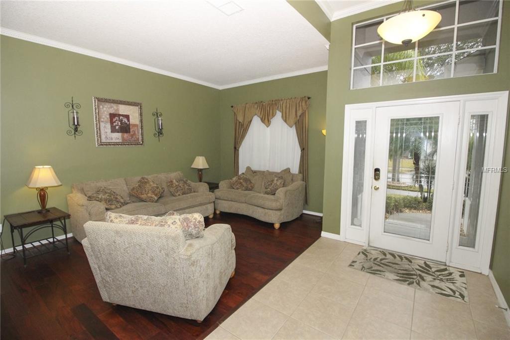 8493 LAKE WINDHAM AVENUE, ORLANDO, Florida 32829, 5 Bedrooms Bedrooms, 10 Rooms Rooms,3 BathroomsBathrooms,Residential,For sale,LAKE WINDHAM,O5556161