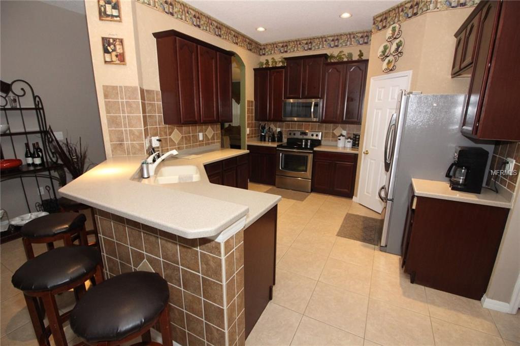 8493 LAKE WINDHAM AVENUE, ORLANDO, Florida 32829, 5 Bedrooms Bedrooms, 10 Rooms Rooms,3 BathroomsBathrooms,Residential,For sale,LAKE WINDHAM,O5556161